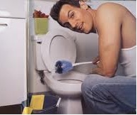 man fixing toilet