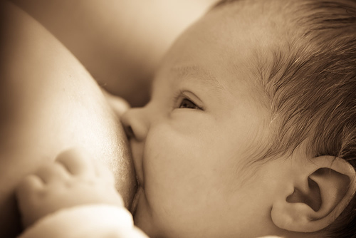 breastfeeding baby sepia