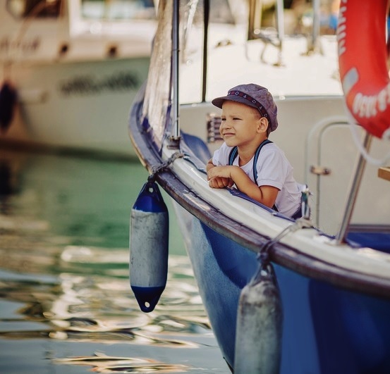 toddler on a sailboat